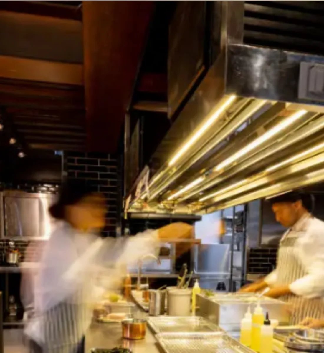 Chefs at work in a busy commercial kitchen