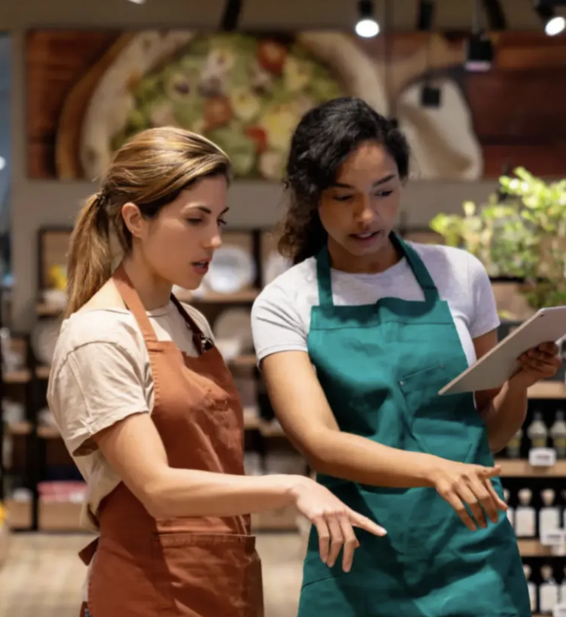 Two retail staff doing a stocktake in a store