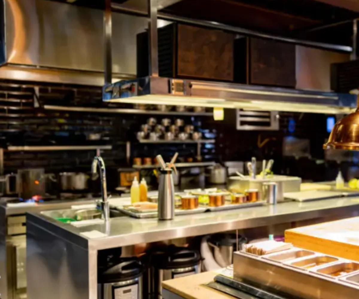 Commercial restaurant kitchen with stainless steel benches