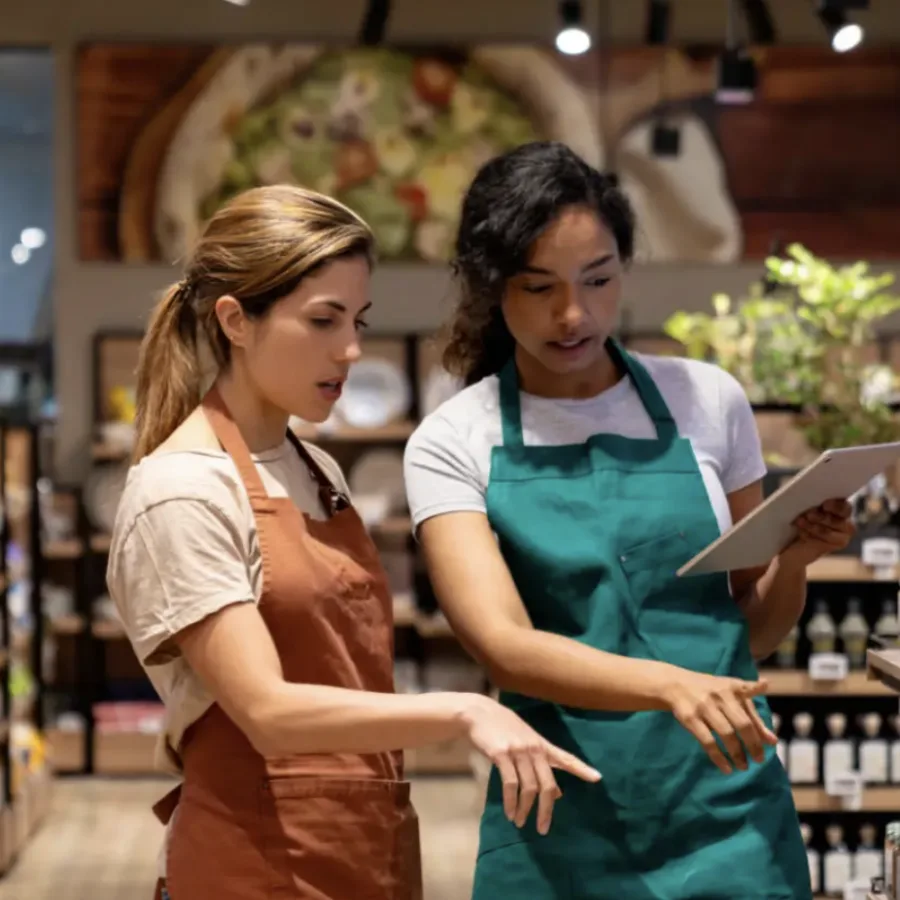 Two retail staff doing a stocktake in a store